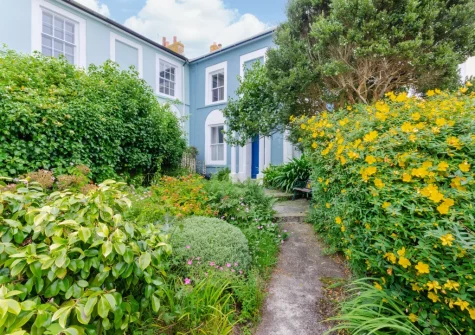 Approach The Blue House along a pathway edged with pretty planting & you'll appreciate the peaceful setting
