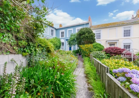Approach The Blue House along a pathway edged with pretty planting & you'll appreciate the peaceful setting