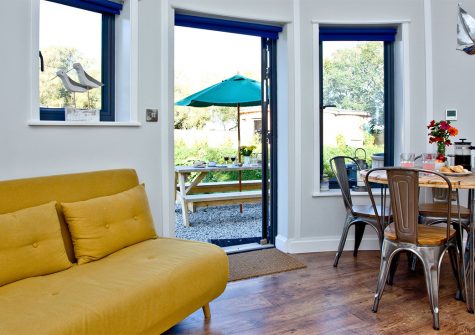 The Boat House Roundhouse, East Thorne, Kilkhampton is a cosy holiday home for four in a quirky roundhouse with logburner. The compact accommodation is comfortably furnished. Onsite amenities include a hot tub, play area & games room. Close to Bude beaches.