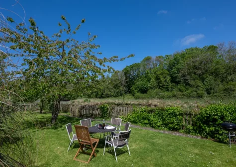 The large enclosed garden & outdoor sitting area at The Boathouse, Little Petherick