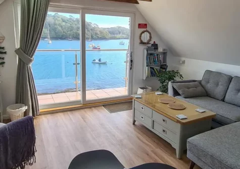 The Boathouse, St Mawes is a delightful riverside cottage offering panoramic Percuil River and harbour views, historic exposed beams, and character-filled charm. Perfect for couples seeking authentic Cornish coastal living in a village location.