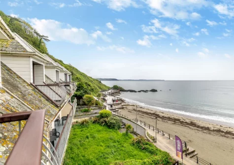 The beach & sea view from the balcony & outdoor sitting area at The Bolt Hole at Admiralty Court, Looe
