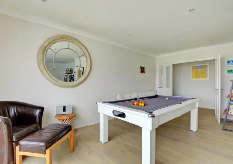 The living room with pool table at The Bower, Trevone