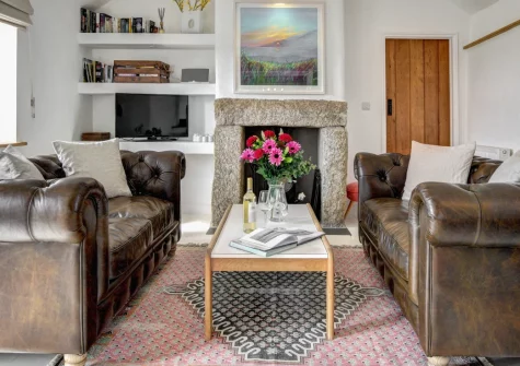 The Byre, Sennen is a beautifully converted granite barn in spectacular West Cornwall, featuring a galleried master bedroom with Scilly Isles views, cosy living spaces, and an enclosed garden, with Land's End and pristine beaches nearby.