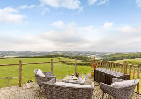 The decked patio & outdoor sitting area at The Cabin, Bideford