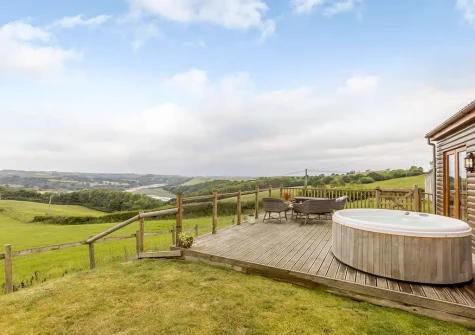 The decked patio, outdoor sitting area, hot tub & garden at The Cabin, Bideford