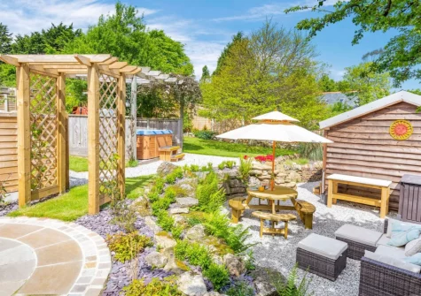 The patio, alfresco dining area, hot tub & garden at The Cabin Retreat, Luxulyan