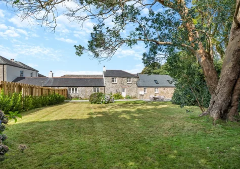 The garden surrounded by lush greenery at The Cart House, Burnthouse