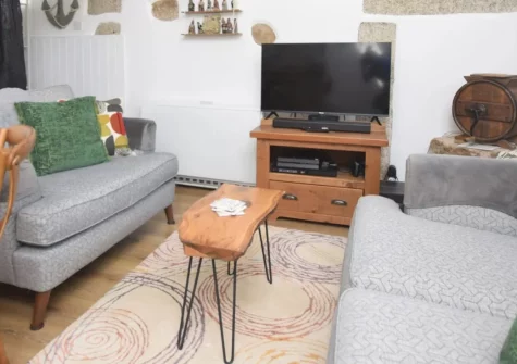 The Churns, Lanhydrock is a beautifully restored one-bedroom Cornish cottage boasting a bubbling hot tub, wood burner, and glorious sun-trap garden — a blissful couples' retreat offering luxury, tranquillity, and the very best of Cornwall.