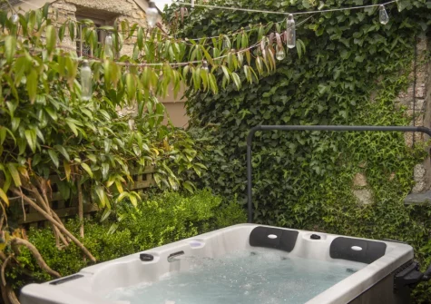 The small enclosed garden & hot tub at The Corner Cottage, Carnhell Green