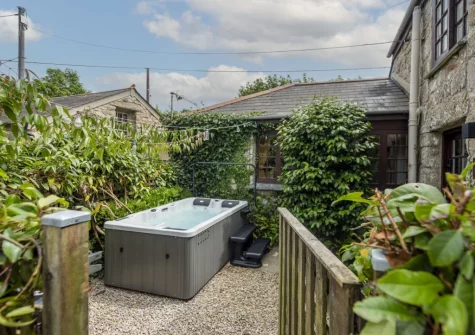 The small enclosed garden & hot tub at The Corner Cottage, Carnhell Green