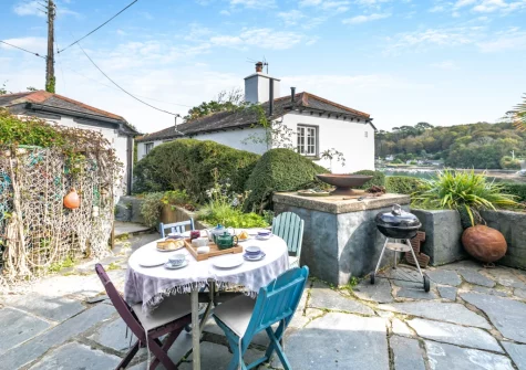 The patio, barbecue & alfresco dining area at The Cottage, Helford