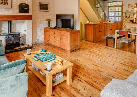 The Counting House, Fowey is a charming three-storey terraced house just 100 metres from the harbour's edge, featuring period character, a cosy wood burner, decked garden, and easy access to Fowey's boutique shops, restaurants and coastal walks.