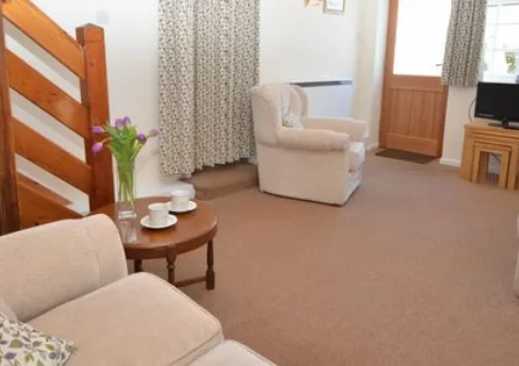 The Dairy, Aylesbeare is a beautifully renovated former dairy cottage set in peaceful Devon countryside, featuring an enclosed garden with open country views, characterful interiors, and the stunning Jurassic Coast just 10 miles away.