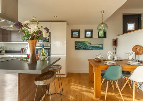 The kitchen & dining area at The Deck House, Morcliff, Goonvrea