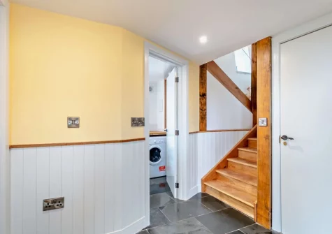 The utility room & stairs up to the first floor at The East Linhay, Leigh Town, Loxbeare