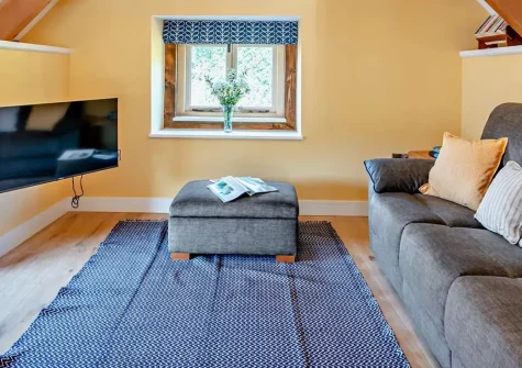 The East Linhay, Leigh Town is a beautifully restored barn conversion with contemporary styling and panoramic countryside views. Perfect for families seeking relaxation, with an enclosed garden, gas BBQ, and direct access to bridleways.