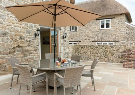 The patio at The Farmhouse at Higher Westwater Farm, Westwater