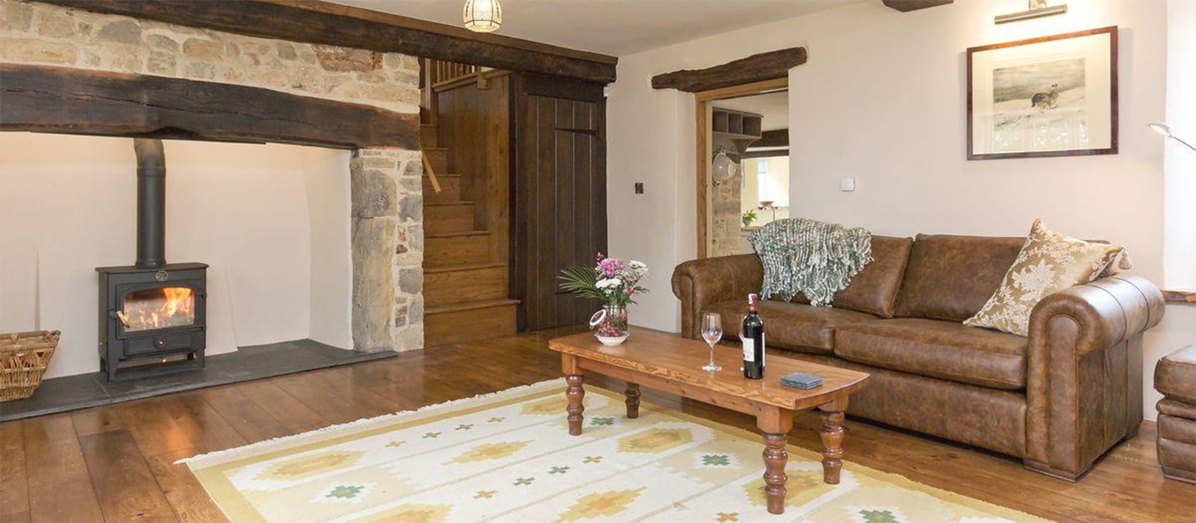The Farmhouse at Higher Westwater Farm, Westwater is a listed thatched farmhouse with three bedrooms & three bathrooms, a beautifully furnished living room with beams & inglenook fireplace. The dining kitchen has an electric range. Patio & garden with rural views.