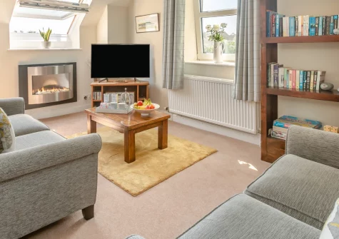 The Gables, Appledore is a welcoming second-floor apartment in the heart of this historic harbour village, featuring estuary views, cosy interiors with real-effect fire, and easy access to North Devon's beaches and the scenic Tarka Trail.