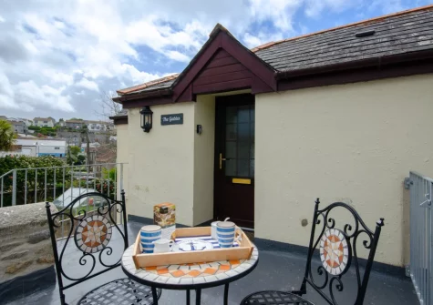 The patio & outdoor sitting area at The Gables, Porthleven
