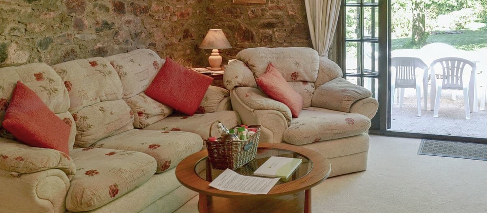 The Garden Room, Cobblestones, Marldon is a two bedroom rural retreat with exposed stone walls, open plan kitchen and sitting area all on one level. French doors open onto the terrace with peaceful garden views. Dartmoor & beaches are nearby.