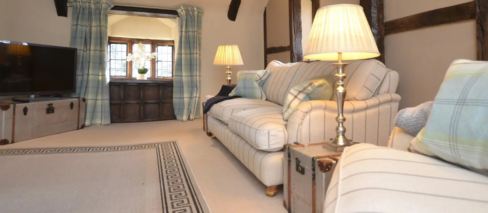 The Gate House, Stafford Barton, Dolton is a romantic one-bedroom historic manor retreat offering period charm, modern luxury, and 750 acres of shared grounds with Exmoor ponies. Perfect for couples seeking tranquil Devon countryside.