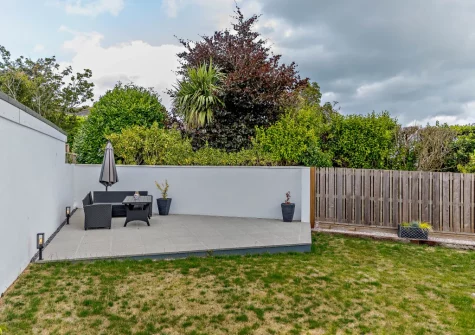 The patio, alfresco dining area & enclosed rear garden at The Gimbals, Galmpton