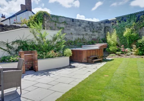 The patio, alfresco dining area, hot tub & garden at The Granary, Muddiford