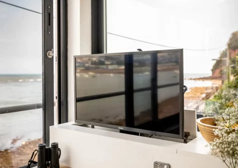 The sitting area, with Smart TV which can be remotely hidden away, at The Gun House, Shaldon