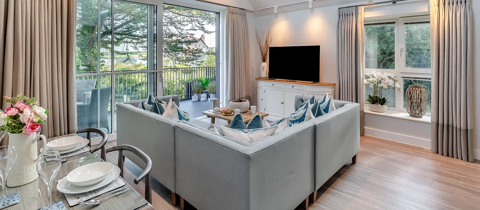 The Harbour Loft, Padstow is a chic two-bedroom apartment in the vibrant heart of this beloved coastal town, boasting stunning estuary views, luxurious furnishings, and an enclosed balcony perfect for savouring authentic Cornish harbour life.