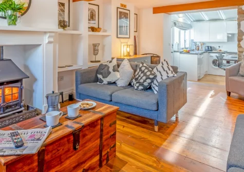 The Haven, Branscombe is a characterful two-bedroom cottage in an 18th-century terrace, featuring a cosy wood burner, stone-built summer shelter with patio views, and National Trust meadows leading to the Jurassic Coast just 500 metres away.