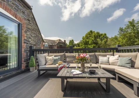 The large decked terrace & outdoor sitting area at The Hawthorns at Roserrow, Polzeath