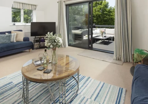 The Hawthorns at Roserrow, Polzeath is a spacious five-bedroom cottage set in peaceful grounds moments from Polzeath's legendary surf beaches, featuring a sunny south-facing terrace, wood burner, and gardens perfect for family gatherings.