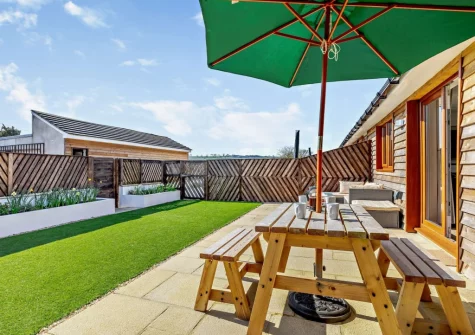 The patio, alfresco dining area & garden at The Hive Retreat, Tytherleigh