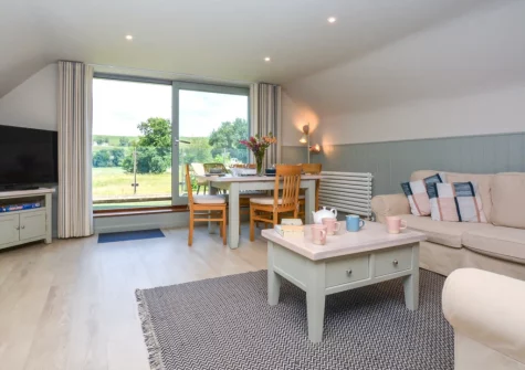 The living & dining area at The Holt at Pillmouth Farm, Landcross