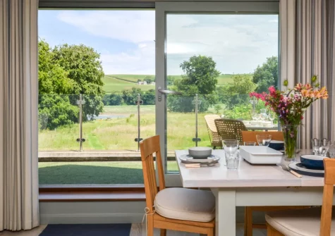 The dining area at The Holt at Pillmouth Farm, Landcross