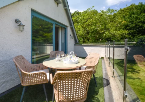 The balcony, barbecue & alfresco dining area at The Holt at Pillmouth Farm, Landcross