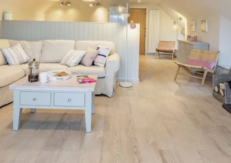 The Holt at Pillmouth Farm, Landcross is a beautifully renovated barn set in peaceful riverside grounds with direct river access, featuring a spacious balcony with Torridge views, characterful beamed interiors, and the Tarka Trail on your doorstep.