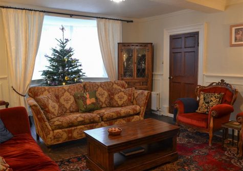 The living area at The House of Black and White, Great Torrington is festively decorated for Christmas