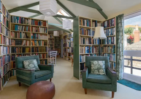 The library, an avid reader's delight, at The Kellan, Mousehole