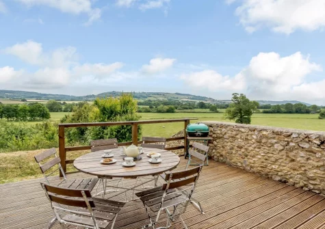 The decked patio, barbecue & alfresco dining area at The Linhay, Oxenlears, Kilmington