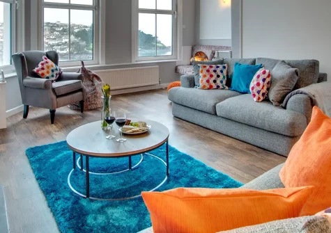 The Lodge at Kylgenna, Fowey is a magnificent Victorian house with breathtaking panoramic river views across the estuary. Perfect for families seeking coastal adventures, featuring elegant period interiors, charming courtyard garden.