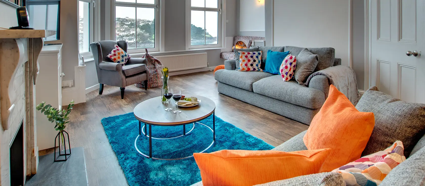 The Lodge at Kylgenna, Fowey is a magnificent Victorian house with breathtaking panoramic river views across the estuary. Perfect for families seeking coastal adventures, featuring elegant period interiors, charming courtyard garden.