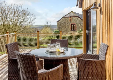 The decked terrace & alfresco dining area at The Lodge at The Linhay, North Tamerton