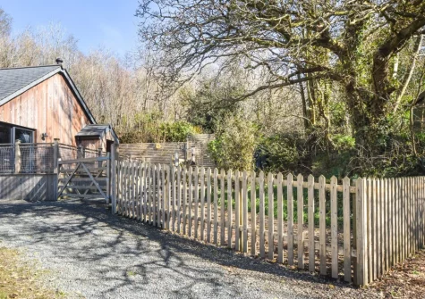 The fully enclosed garden area, perfect for dogs, at The Lodge at The Linhay, North Tamerton