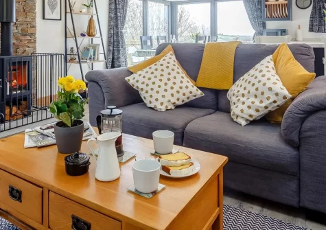 The Lodge at The Linhay, North Tamerton is a luxurious 2-bedroom converted barn featuring soaring vaulted ceilings, 10 acres of private grounds with lakeside setting, and perfect access to explore Devon & Cornwall's finest attractions and beaches.