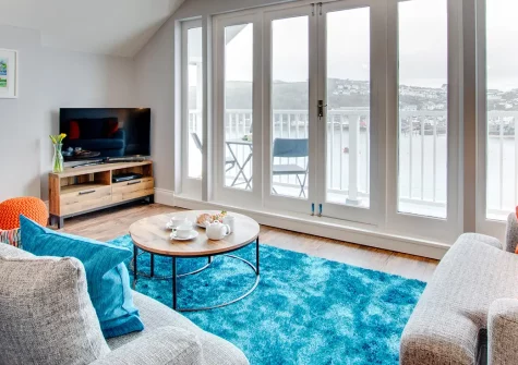 The Loft at Kylgenna, Fowey: a charming riverside apartment sleeping two with spectacular estuary views. Enjoy alfresco dining on your balcony, explore Fowey's shops and galleries. Perfect for romantic Cornish getaways and memorable coastal escapes.