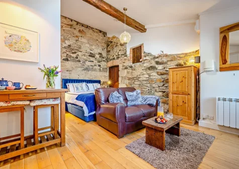 The living area at The Loggin, Trebudannon