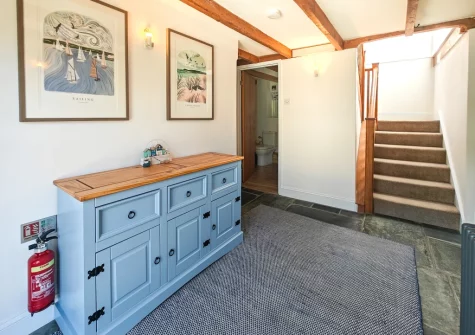 The hallway & stairs up to the first floor at The Long Barn, St Ervan